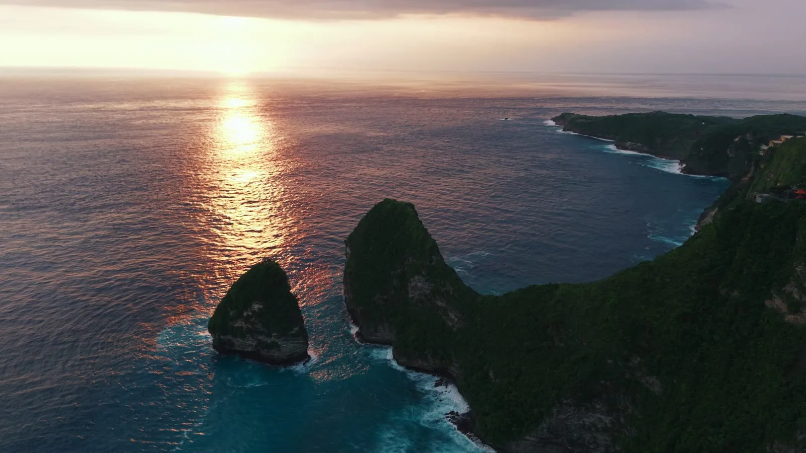 Sunset over a cliff coastline in Bali